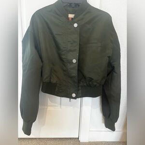 Woman’s green bomber jacket